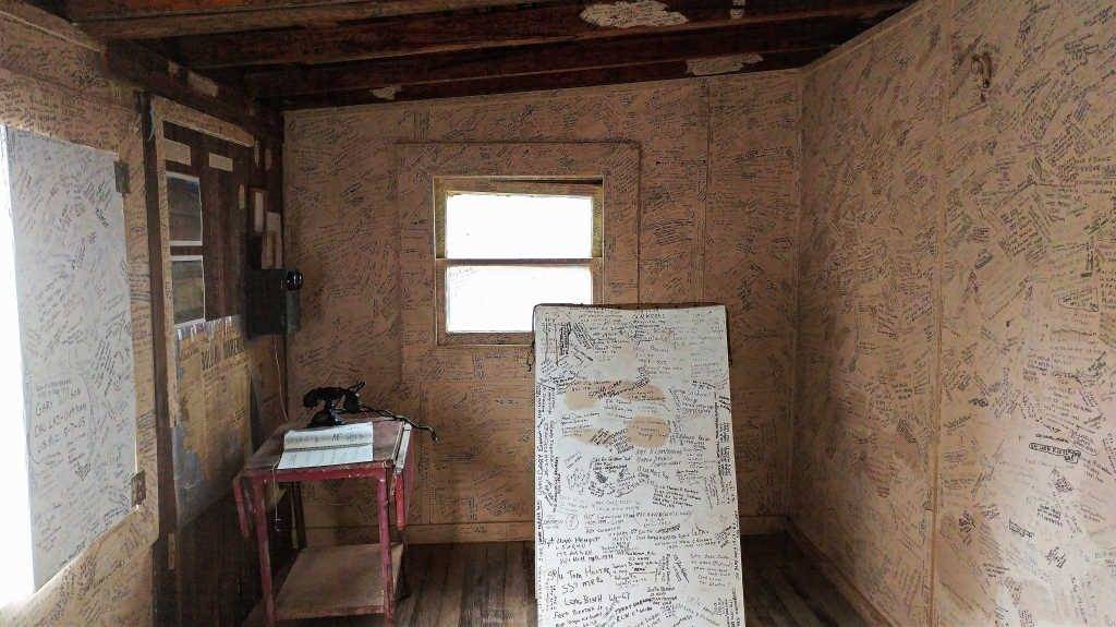 Military and Veterans signatures cover every surface in the barbershop of Castle Dome City