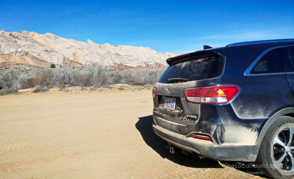 Mae Sorento earned that dusty bumper after a drive down Burr Trail Road