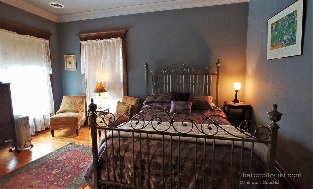Queen bed in the Iris Room at Decker House B&B