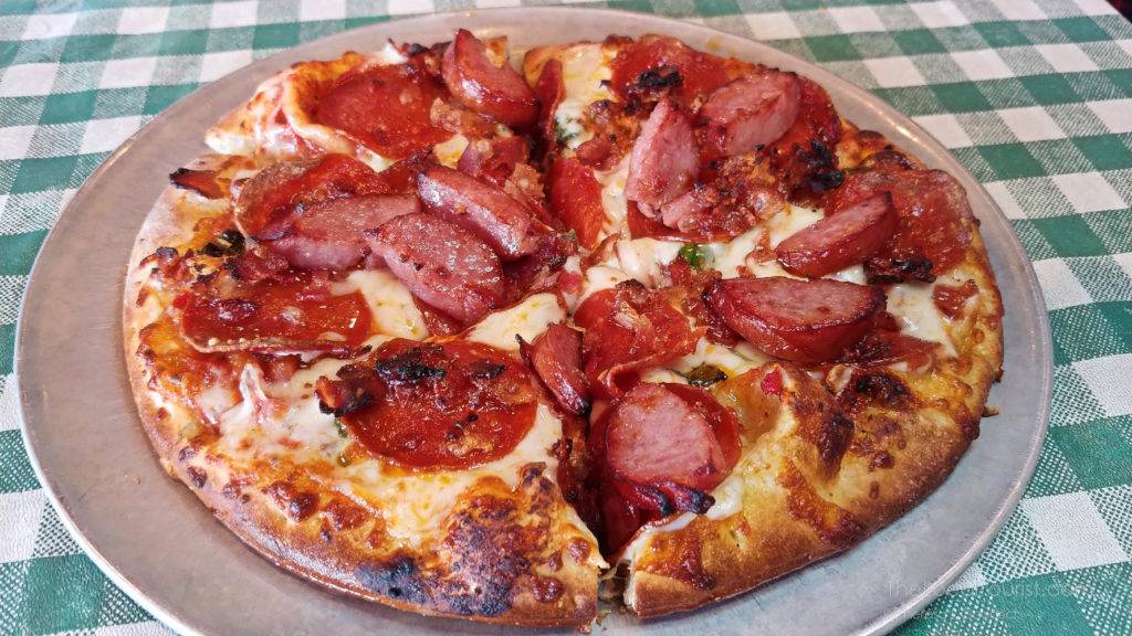 Sweet Lil' Razorback, a meaty concoction of pepperoni, smoked sausage, and bacon with a touch of basil and garlic, at Bucceto's, one of many favorite Bloomington Indiana restaurants
