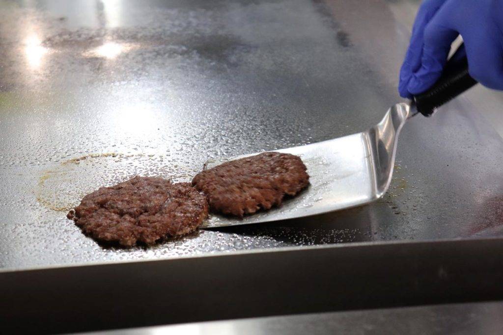 Burgers being served from griddle