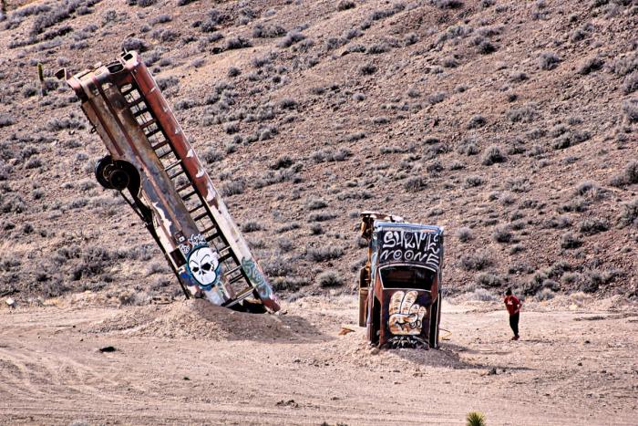 buried bus and car