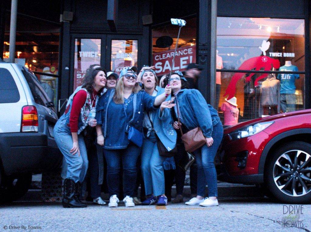 Selfie takers at Eureka Springs Mardi Gras parade