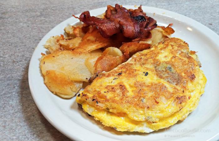 Omelette, American potatoes, and bacon at Franks Diner