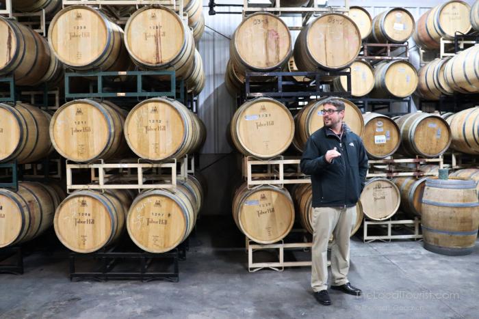 Matt Moersch sharing his passion for wines at Table Hill Winery's barrel room