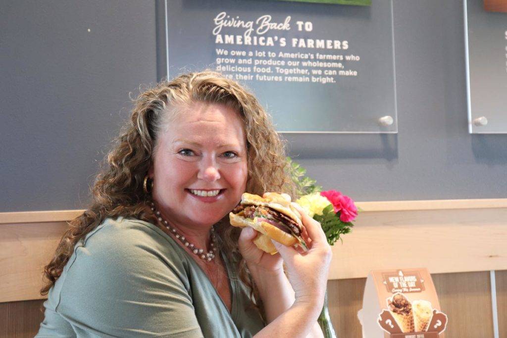 Smiling Theresa showing off her Culver's ButterBurger