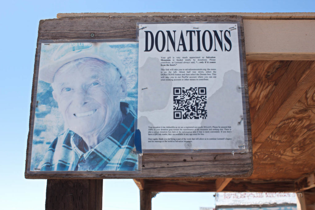 Donation request at Salvation Mountain with photo of Leonard Knight