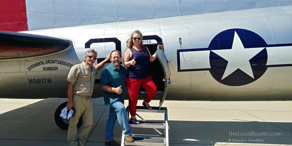 Pilot Tom Ewing, Jim Goodrich, and Theresa Goodrich outside Aluminum Overcast
