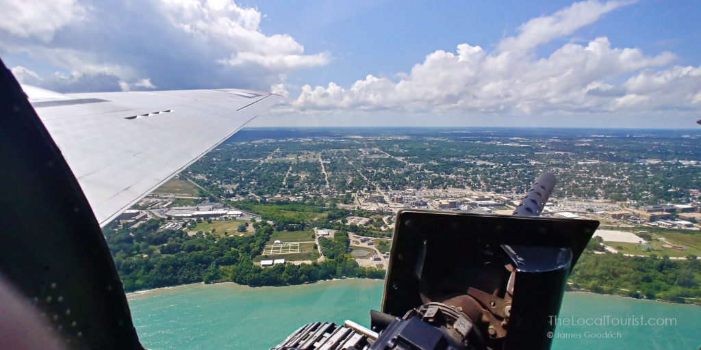 Machine gun and view from the seat by the rear-entry door of a B-17 Flying Fortress