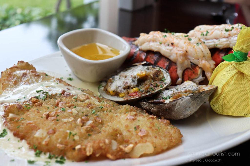 cold water lobster tail, savory clams casino with bacon, and delicate New England flounder coated in an almond crust with a champagne-shallot cream sauce at Grand Victoria Casino a restaurant in Elgin Illinois