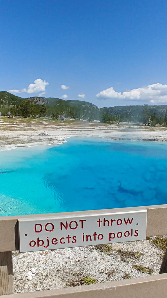 "Do not throw objects into pools" sign near pool in Yellowstone