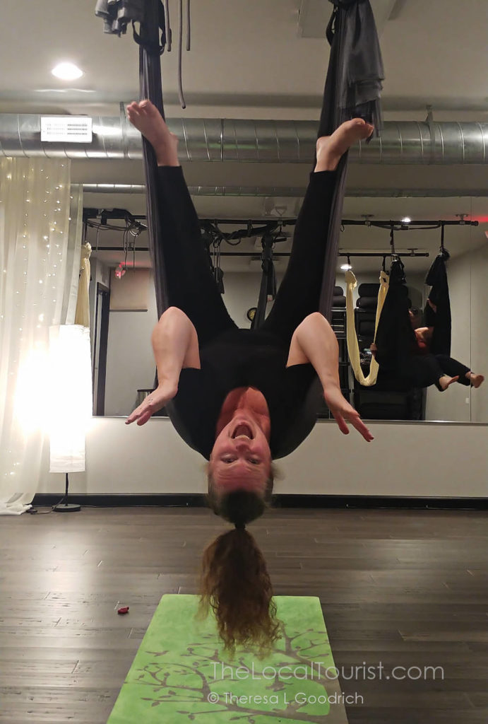 Theresa getting inverted at aerial yoga