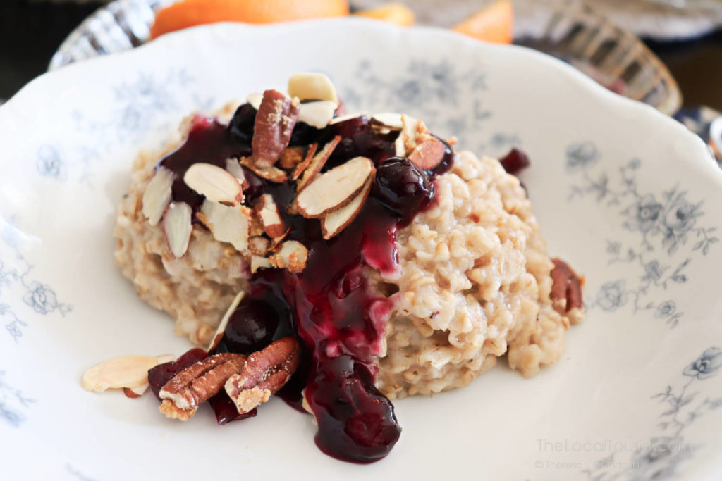 Oatmeal with blueberry compote and roasted slivered nuts