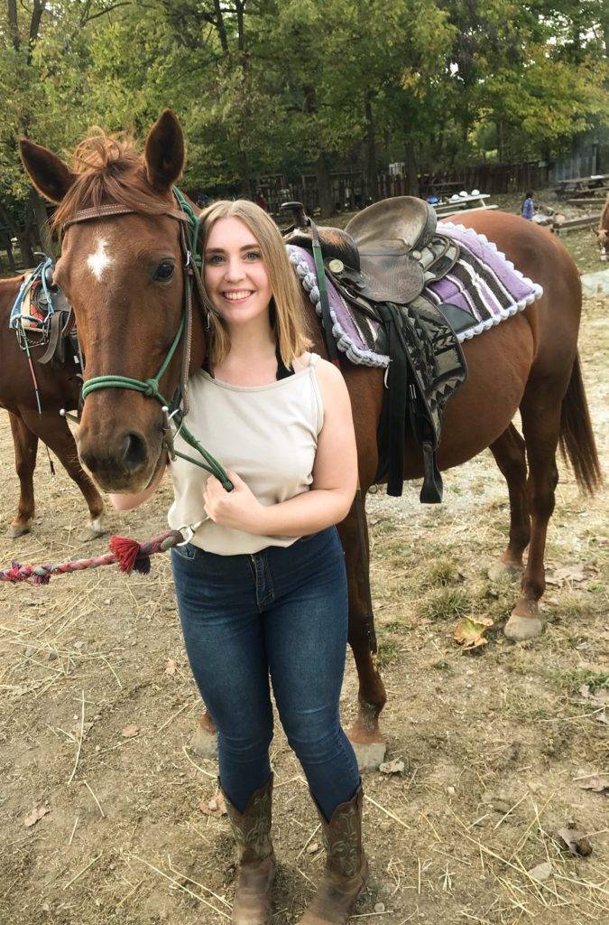 Anna Pool and the horse she rode during a recent visit to Natural Valley Ranch.